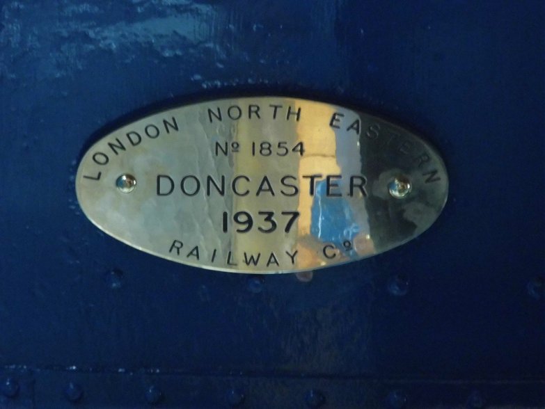 Builder's plaque of Dominion of Canada relocated to original position inside the cab.