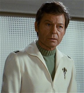 McCoy models the senior medical uniform seen in ST II