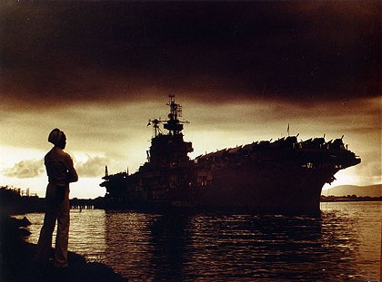 USS Enterprise CV-6 at Ford Island, Pearl Harbor, 24 September 1945. Photograph by William T. Barr, PhoM 1/c. Robert Anderson, PhoM 2/c is in foreground.
